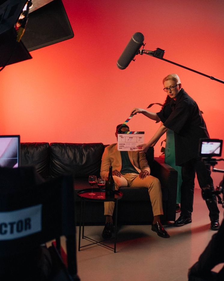 A film set lit in red, with a director's chair